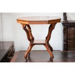 An Edwardian mahogany octagonal top occasional table, with shaped legs and central low shelf with