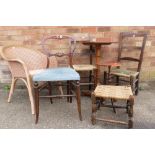 A group of three chairs with rush seats, a wicker armchair, a Victorian occasional table, wine table