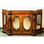 A Victorian burr walnut credenza, with shaped white and grey marble top above two mirrored doors;