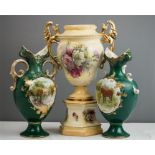 A pair of decorative Edwardian vases, with green ground and painted with scenes to the centres,