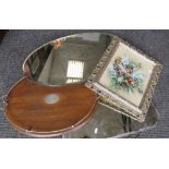 A mahogany oval tray, two wall mirrors and a picture.