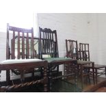 A pair of oak hall chairs together with three single chairs. (5)