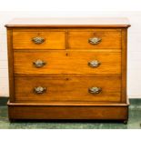A Victorian mahogany chest of drawers, with two short over two long drawers, raised on castors.