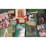 A quantity of Cricket related books.