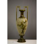 A large stoneglazed 20th century urn form vase, with green glaze, the baluster body bearing twin