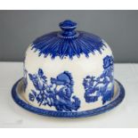 A blue and white ceramic cheese dome.