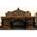 An impressive 19th century oak sideboard with 18th century elements; caryatids and atlante