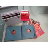 A case of records, a red case of 45's and a folio of His Masters Voice records.