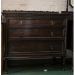 An oak chest of drawers with graduated drawers and having ropetwist decoration.