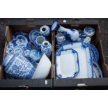 A group of blue and white ceramics including meat plates.