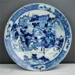 A late 19th century blue and white Chinese charger depicting warriors, 36cm diameter.