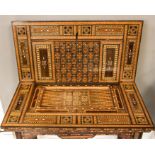 A 19th century Middle Eastern ivory, bone, mother of pearl, ebony and hardwood parquetry games