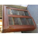 A Victorian mahogany book case with cornice above foliate carved brackets, glazed doors enclosing