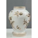 An early 20th century porcelain vase, hand painted and gilded to depict flowers, marked 'D' in