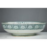 A large Victorian oval bowl with green transfer printed decoration.