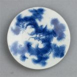 A late 19th century Chinese blue and white dish depicting a dragon.