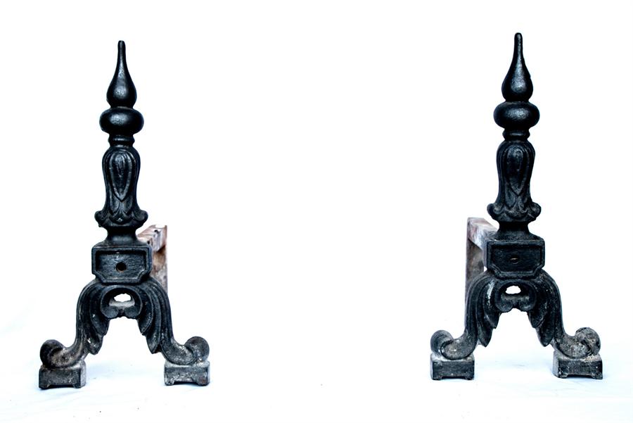 A pair of andirons.