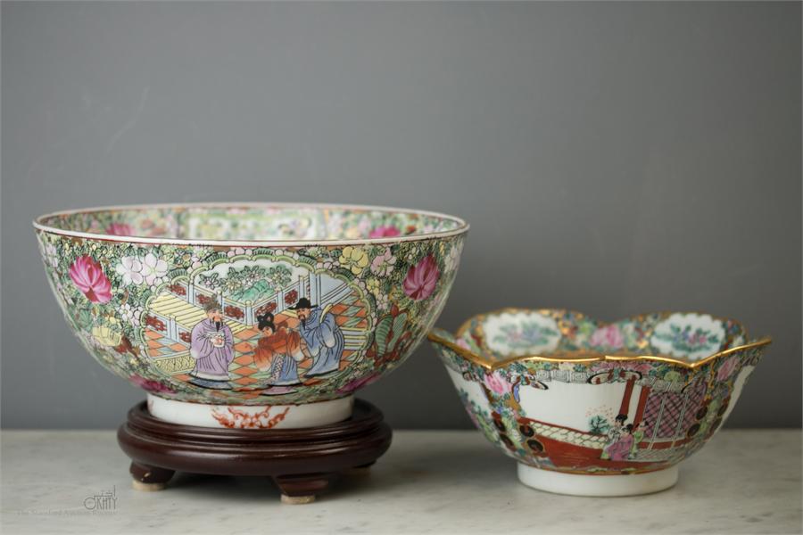 A 20th century Chinese bowl on stand and a similar bowl with shaped rim, both enamelled with figural