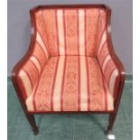 An Edwardian mahogany armchair with inlaid decorat