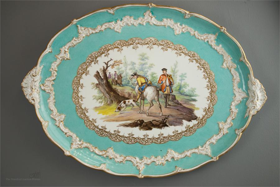 A Meissen oval platter, incised C 177A to the base, depicting huntsmen within a border or raised