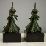 A pair of George Raoul Garreau bronze figures of fish, green patinated, Art Deco period, raised on