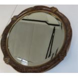 A mahogany overmantle mirror and a circular wall m