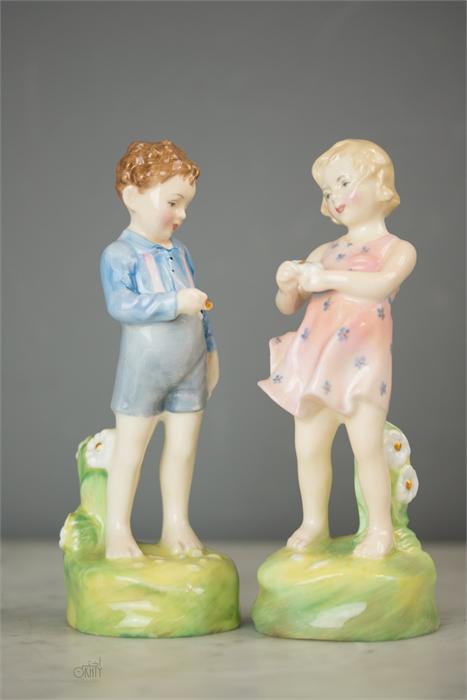 A pair of Royal Doulton figures 'He Loves Me' HN20