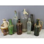 A quantity of excavated glass bottles of various s