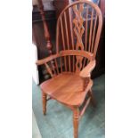 A pine Windsor armchair with pierced splat, spindl