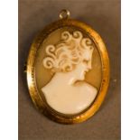 A 9ct gold cameo brooch; female profile portrait, 3cm high.