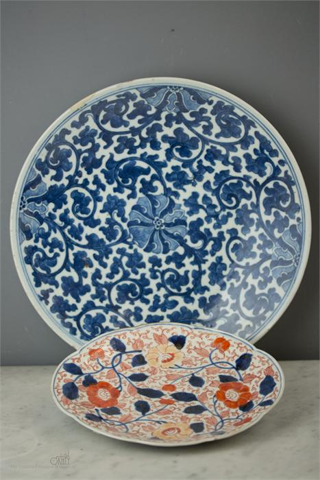 A late 19th century blue and white charger with fo