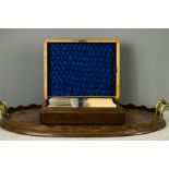 A 19th century oval mahogany inlaid tea tray with brass handles together with a set of dessert