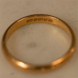 A 22ct gold wedding band, size N, 3.4g.