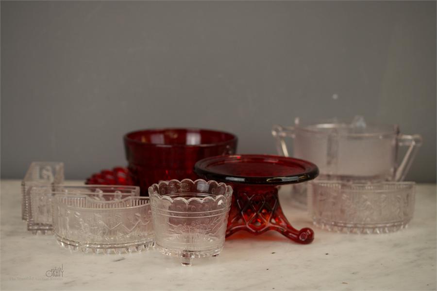 A group of Sowerby glassware, to include three dishes modelled with figures, a red 'lattice' work