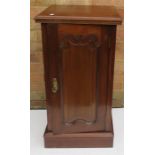 An Edwardian cupboard, with a shaped fielded panel