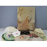 A group of needlework panels, two shawls and a Gros Point panel depicting a peacock.