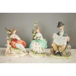 Two Capodimonte figurines, one inscribed Merli, woman reading and woman with cherub, together with