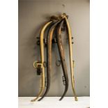 Two horse collars, one in brass stamped No.2 Patent, together with an iron and wood collar. (2)