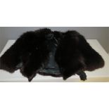 A fur stole with satin lining.