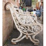 A Victorian cast iron Colbrookdale style garden bench, the decoratively cast painted ends united