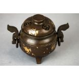 A bronze Chinese koro, with gilt decoration.