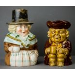 An antique porcelain Welsh Toby jug; woman in traditional Welsh attire, together with a Dartmouth