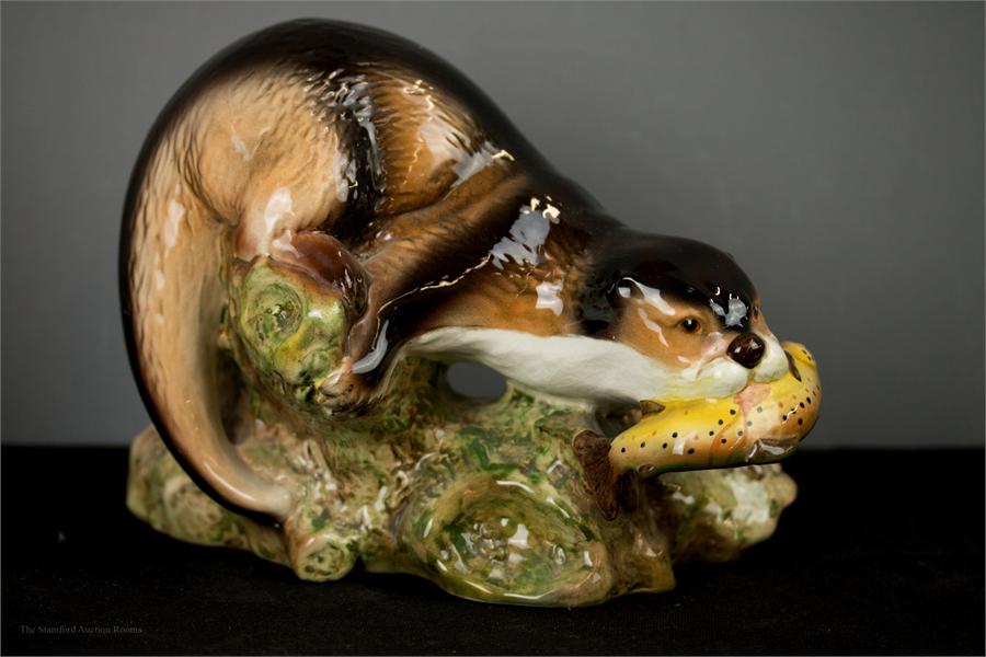 A Sylvac vase in the form of an otter catching a fish, impressed 3459 to the base.