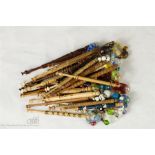 A quantity of turned treen lace makers bobbins wit