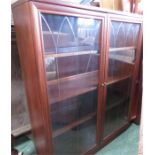 A mahogany glazed bookcase, with two interior shel