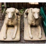 A pair of reconstituted stone greyhounds.