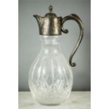 A silver plate and cut glass claret jug.