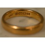 A 22ct gold wedding band, size K, 5.4g.