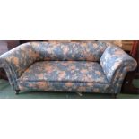 An Edwardian settee, padded form with outwardly sc