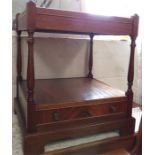 A mahogany side table with low shelf with single d